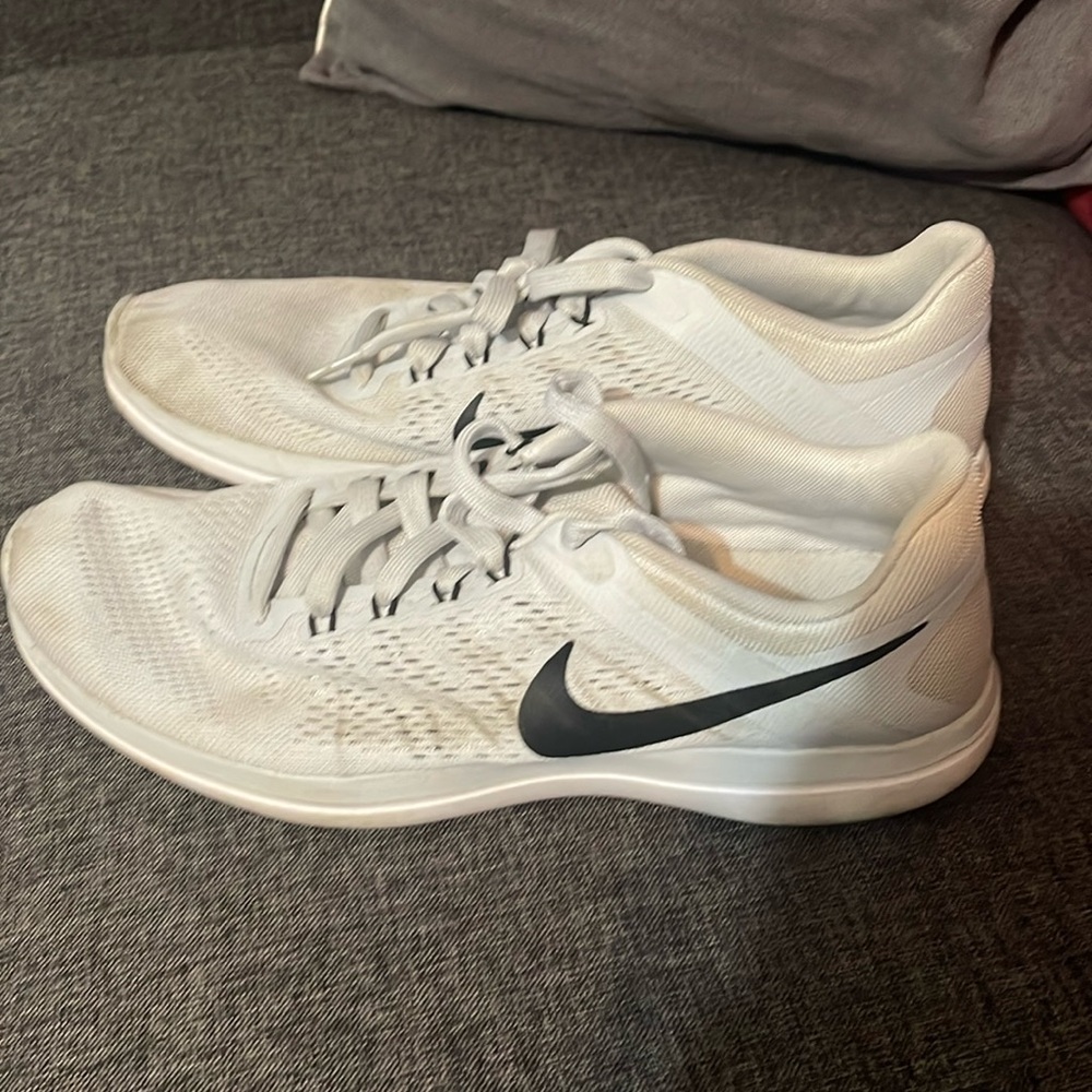White Nike athletic shoes